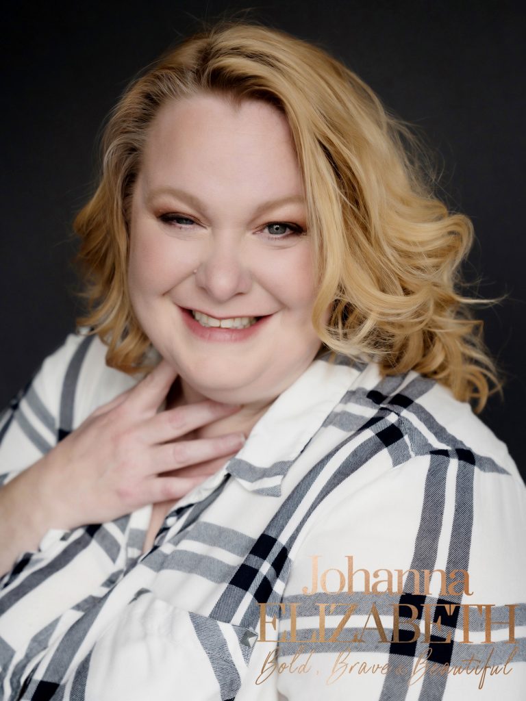 Smiling lady wearing a checked shirt