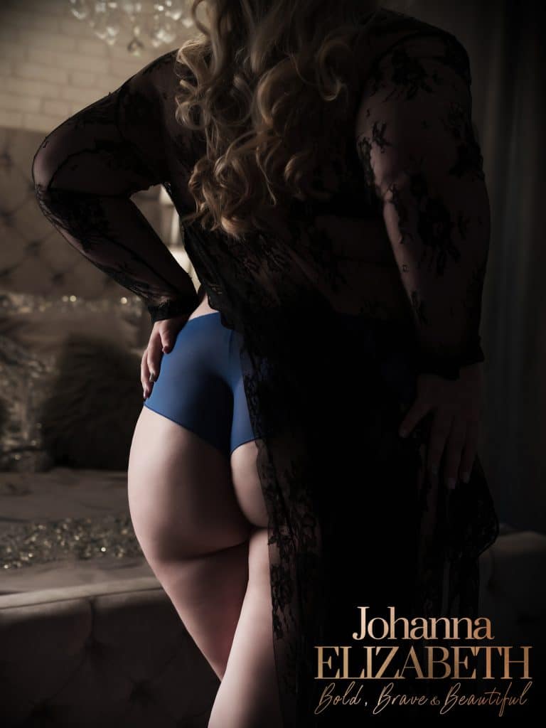 Woman wearing blue and black lingerie
