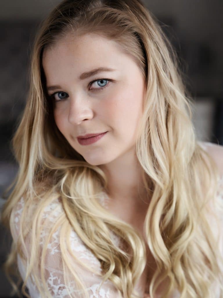 Smiling blonde woman looking to camera