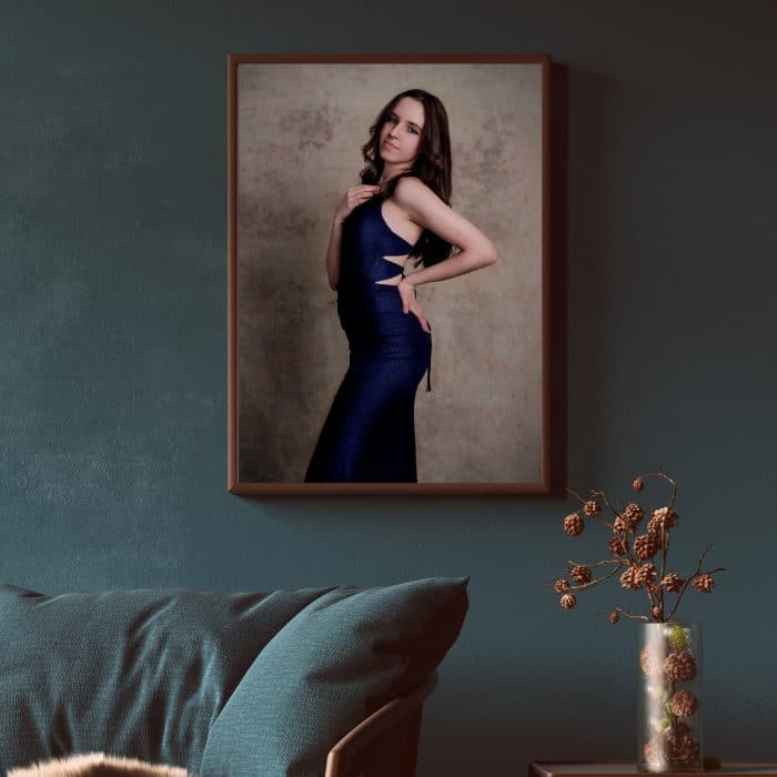 Beautiful portrait of a yong woman in her prom dress mounted on the wall